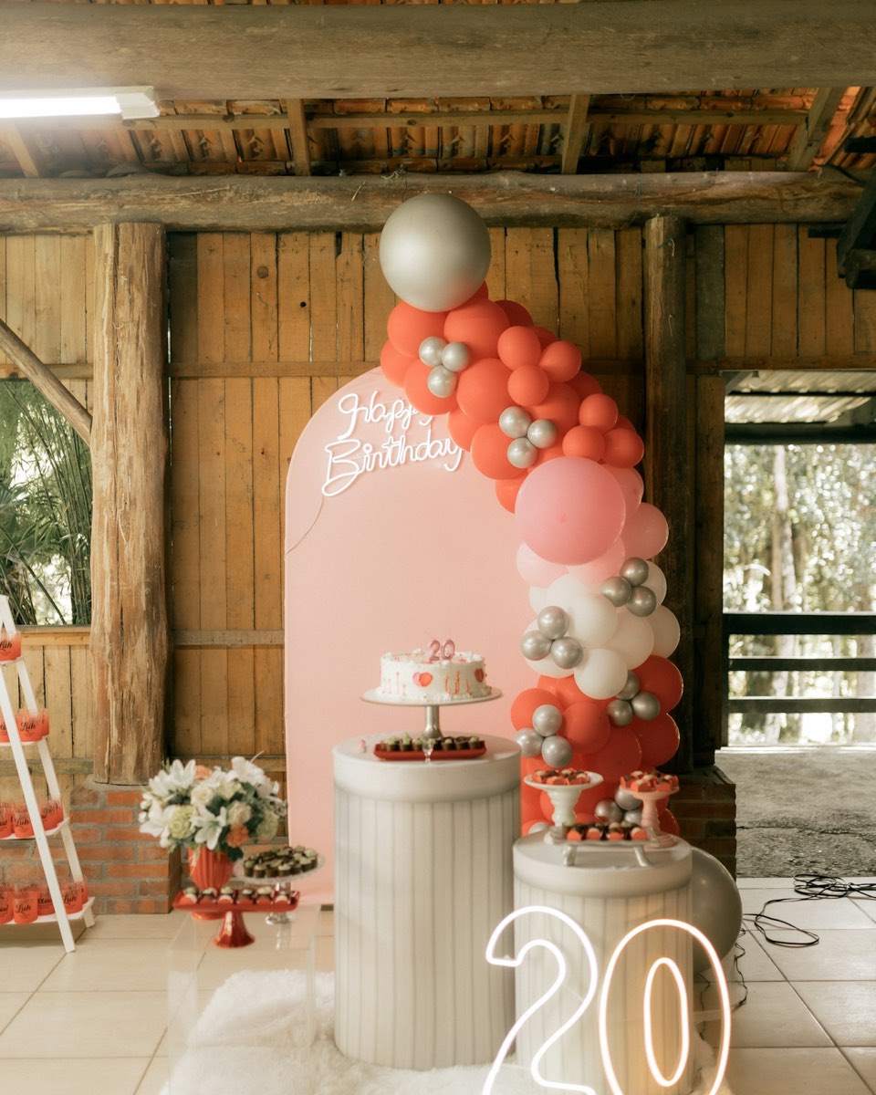 Organic balloon garland and birthday backdrop styling